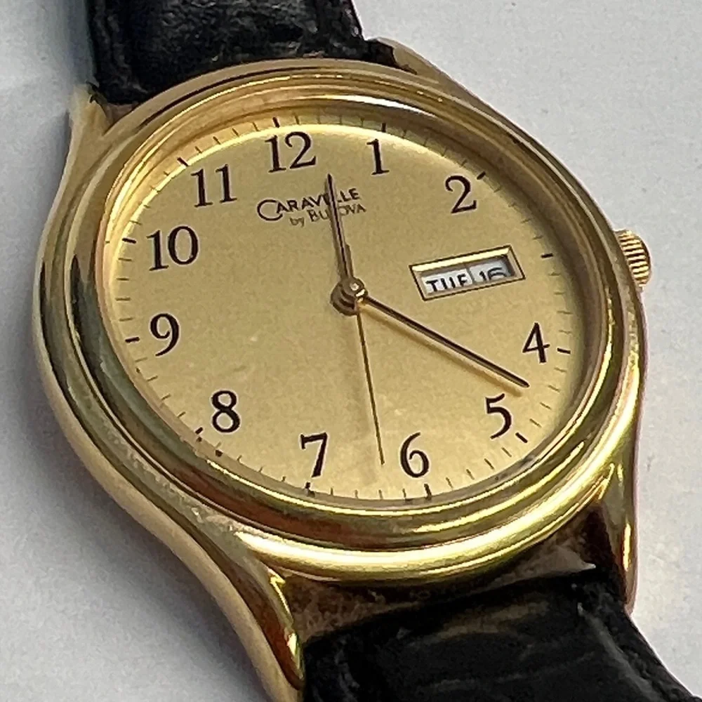 Caravelle by Bulova Vintage Quarts Watch Day Date Second Hand Function